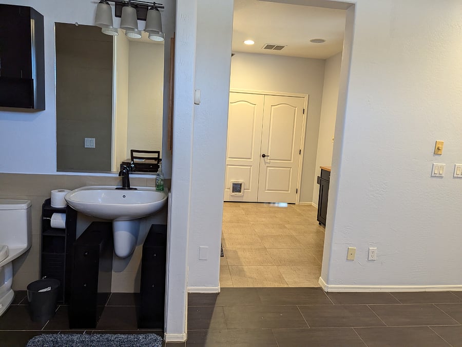 Bathroom and entrance into living room area