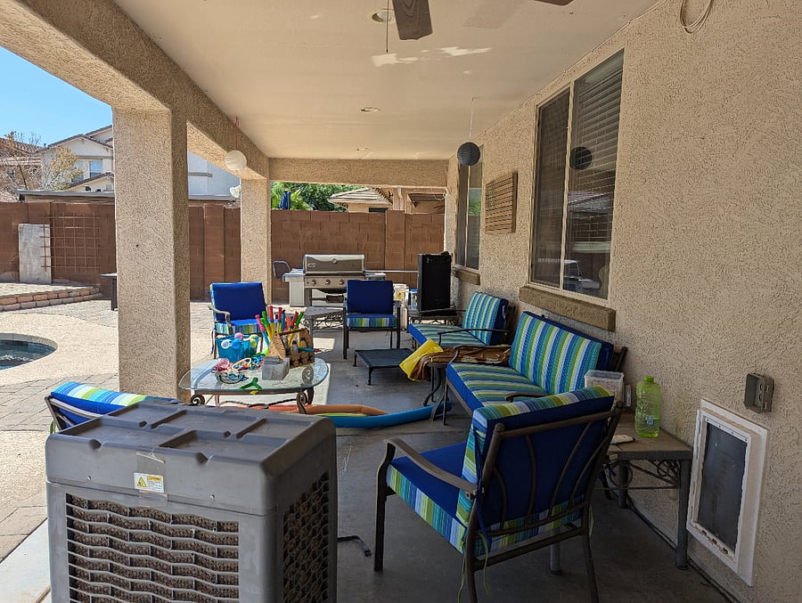 Back patio seating area with grill and smoker