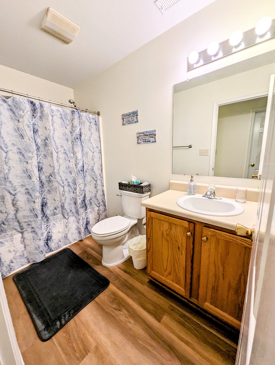 Shared full bathroom with tub