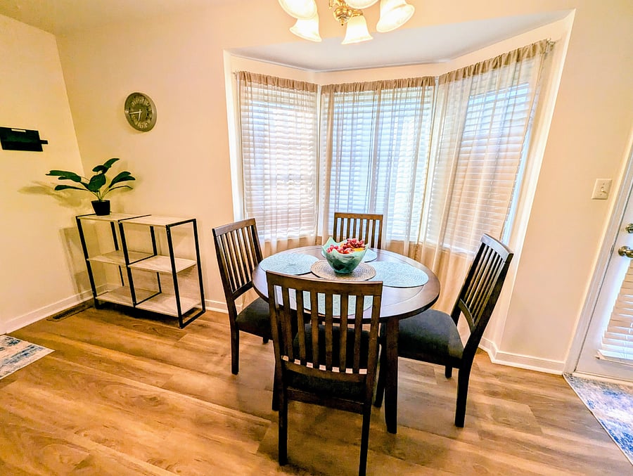 Breakfast nook and kitchen entry to garage/fitness area