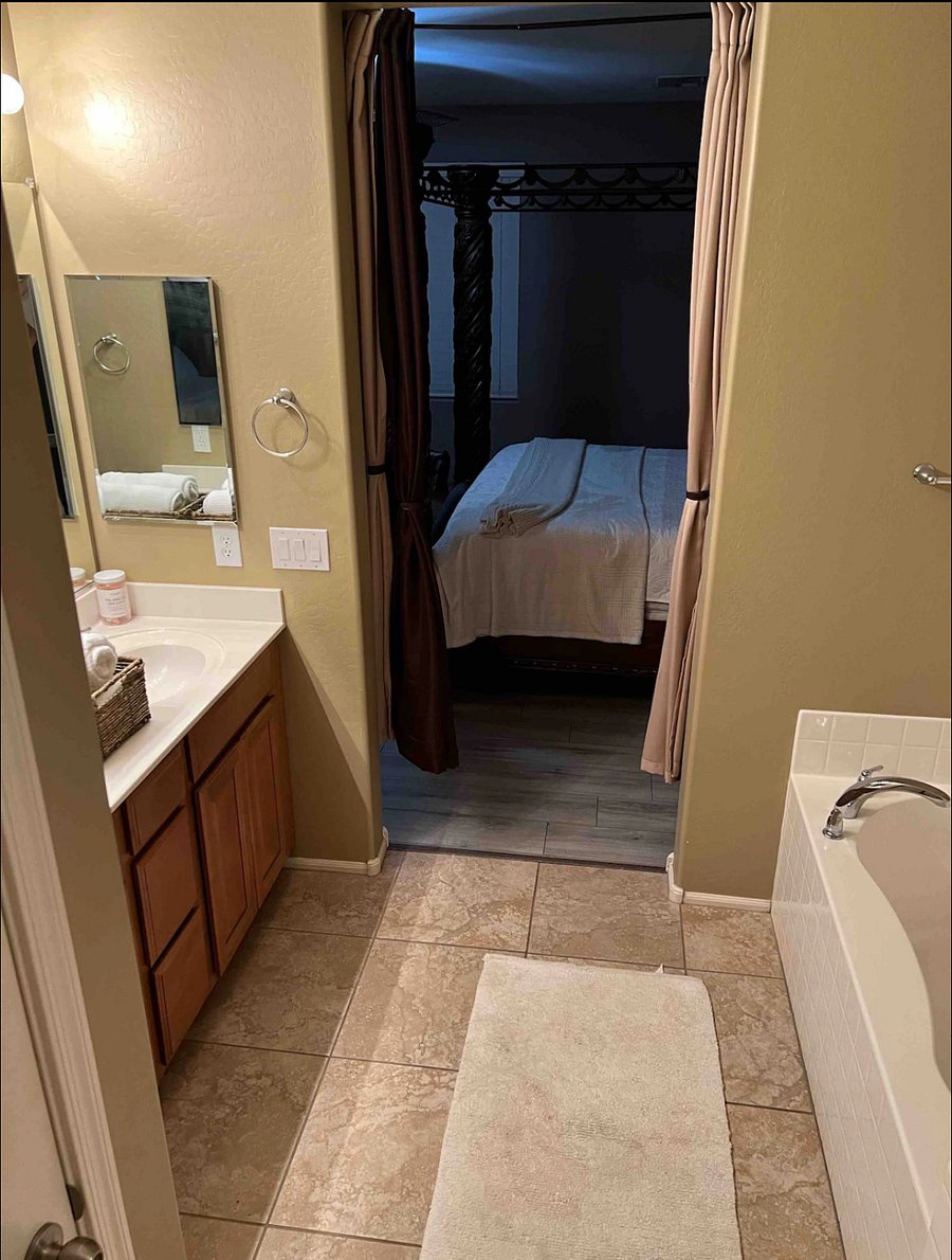 Private bathroom with large bathtub and shower