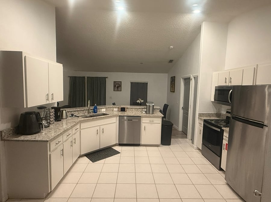 Kitchen - Luxurious Granite countertops in kitchen & baths; Ninja air fryer, coffee maker, blender, ice maker, cookware, tableware, utensils & cutting board.
