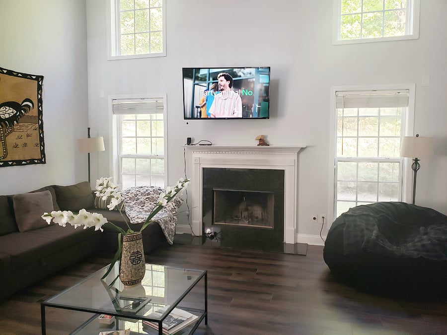 Common area: Spacious, yet cozy living room/ great room. Smart TV, wood-burning fireplace and lots of light.