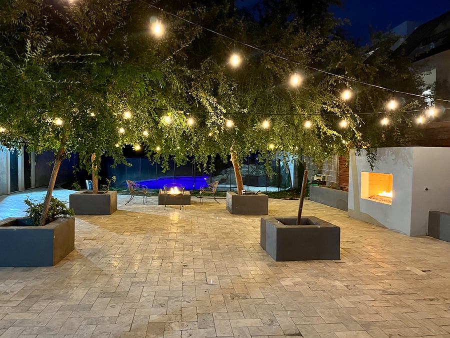 Paved patio with fireplace and fire pit