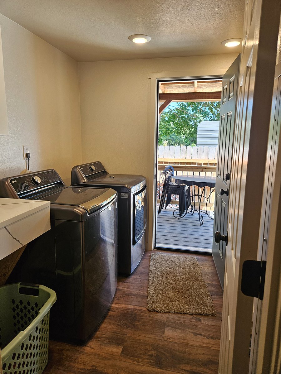 Full laundry room with access to the back deck