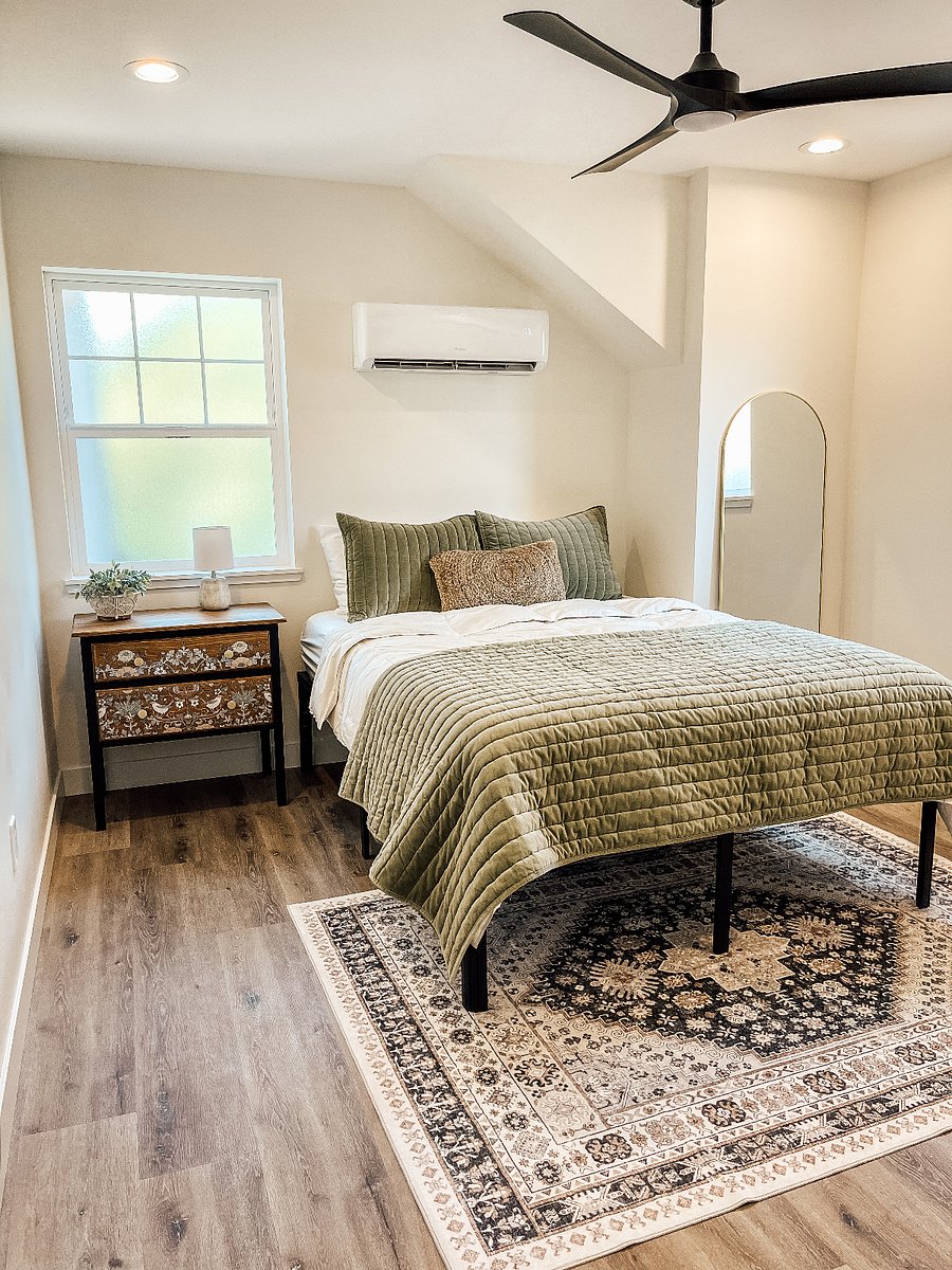 Bedroom with queen bed, 2 drawer nightstand and full length mirror