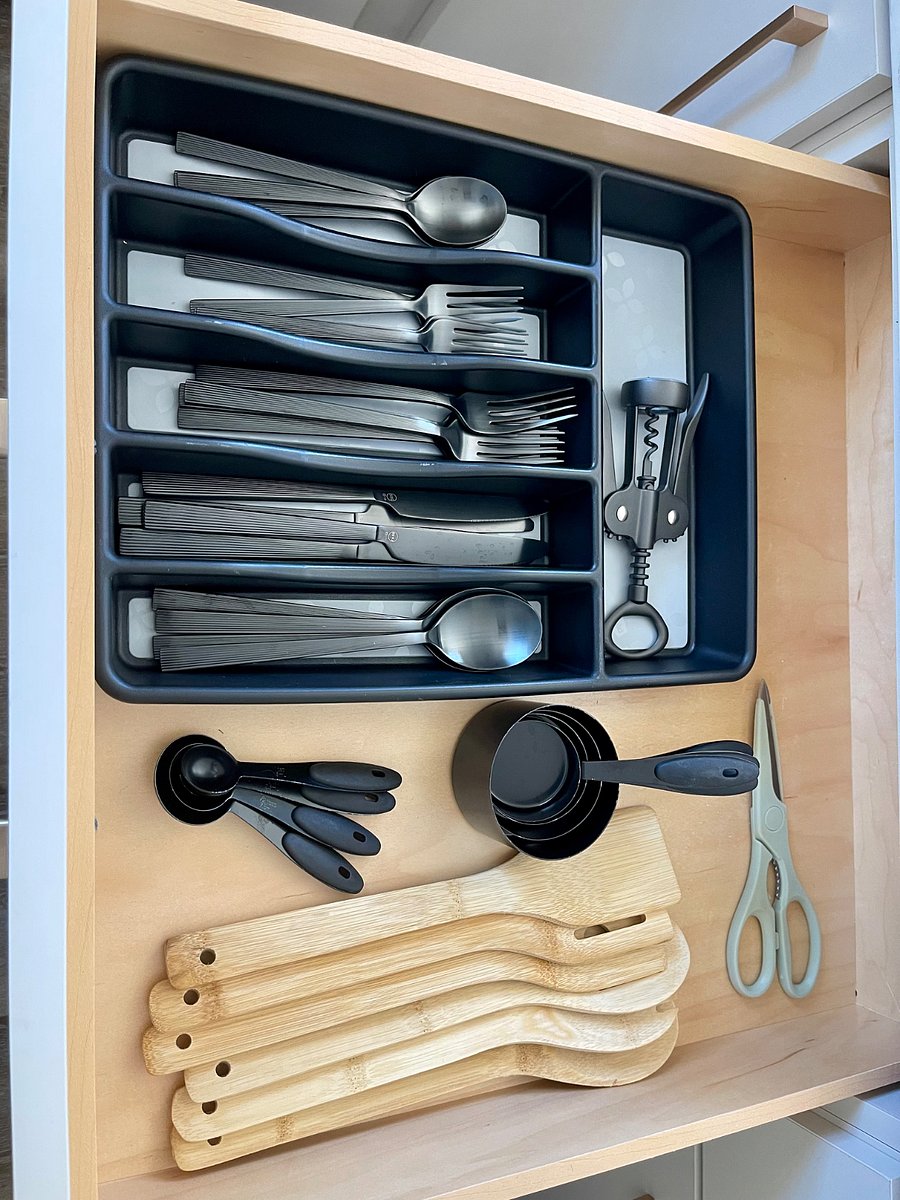 Silverware, measuring cups, spoons and wine opener