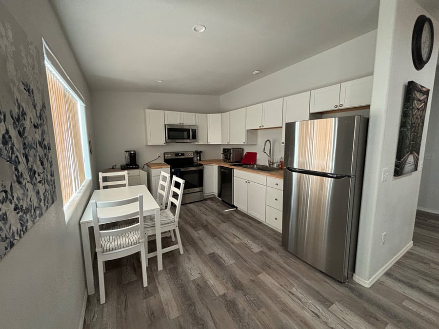 Large kitchen with table, full size appliances, toaster oven, K-Cup coffee maker,