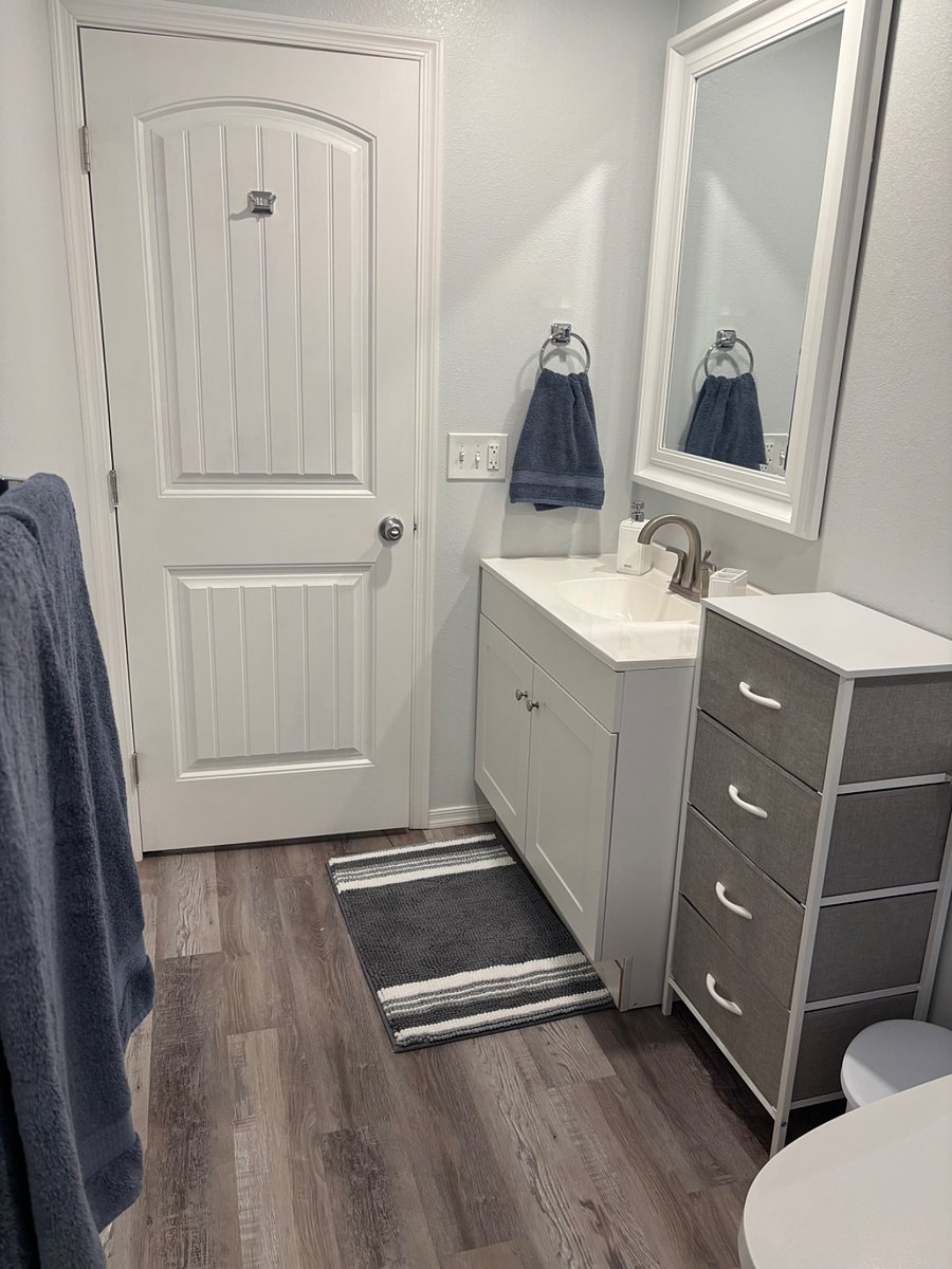 Large bathroom, touchfree toilet, plenty of storage, hair dryer