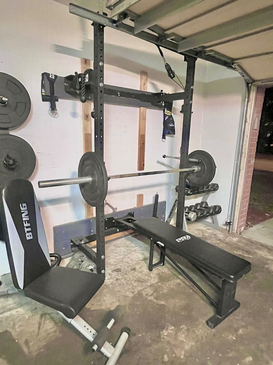 Keep your exercise in check! Weight set, green weights, mat to stretch.