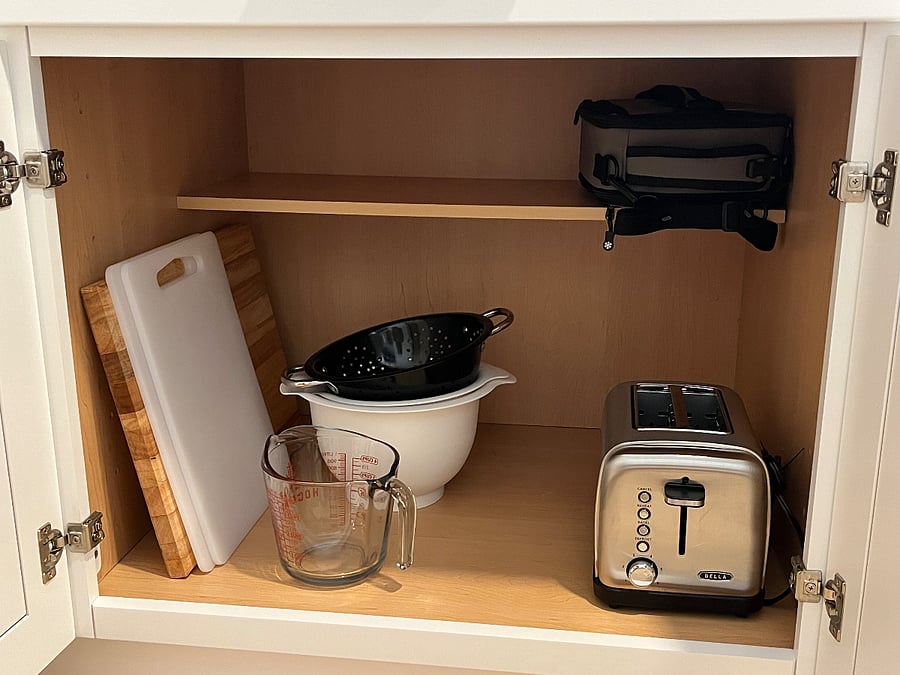 Mixing bowls, strainer, toaster, lunch box, and cutting boards