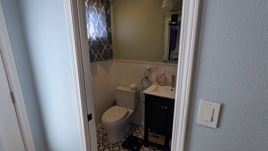 In front of bathroom door