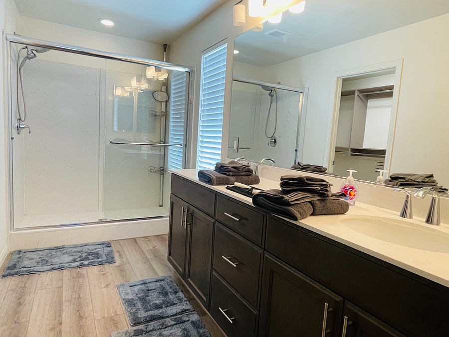 Dual sinks, stand up shower, and a walk-in closet. 