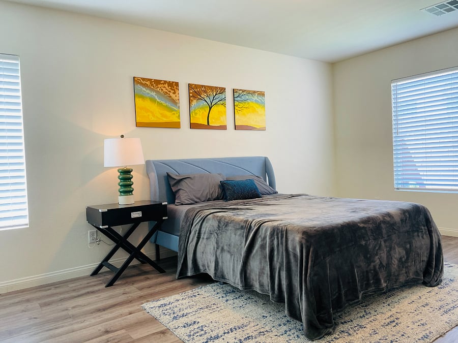 Bedroom has a mirror, plenty of natural light, and maintains a great temperature year-round.
