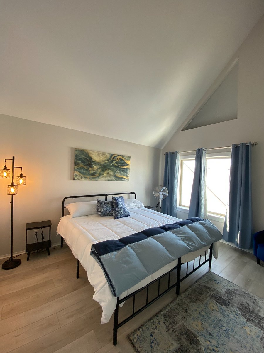 Large main bedroom on 3rd floor with king size bed, night stands have charging ability.