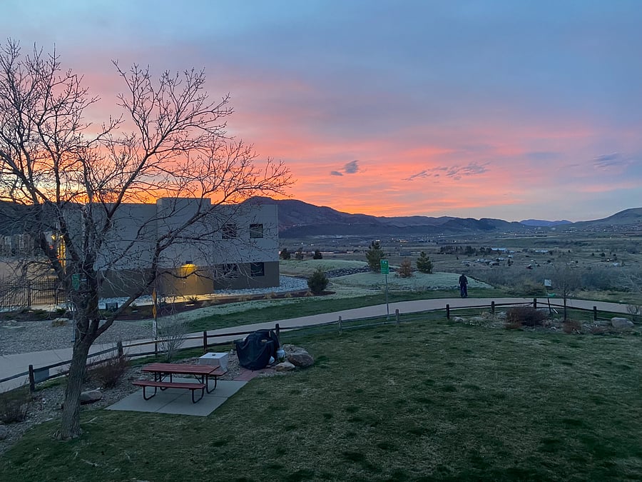 Balcony full view of mountains, condo green space and Bear Creek Lake Park entry.