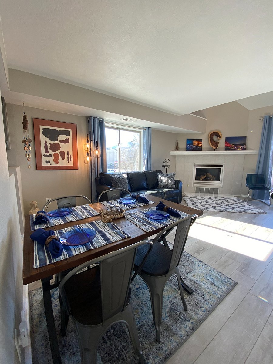 View of dining area and living space with fireplace.