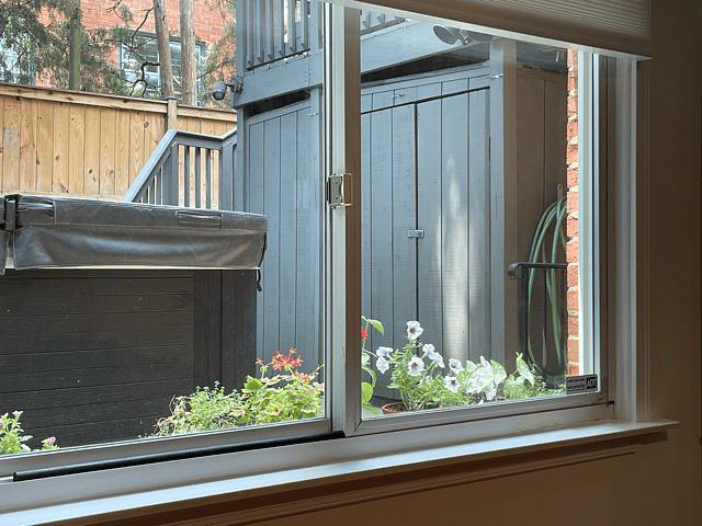 Picture window provides ample afternoon light; full shade can be drawn if preferred; summer residents will receive fresh, home-grown flowers every week