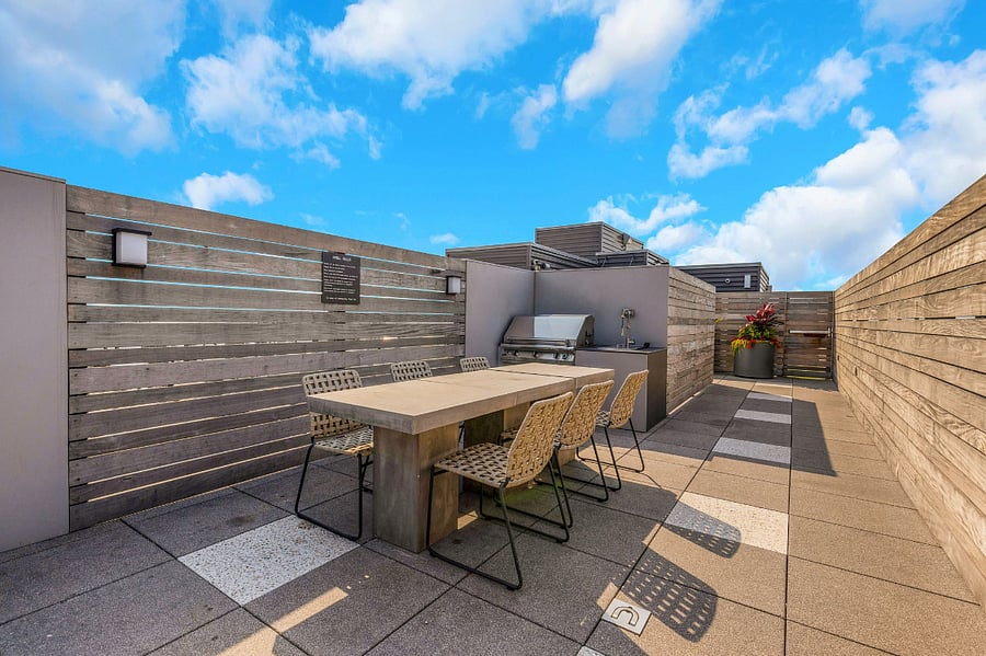 Grill, chill, and soak in the views. This private rooftop deck features a built-in BBQ station and sweeping cityscape  perfect for evening meals or hosting under the Chicago sky