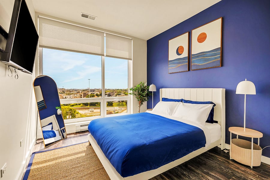 Serene Queen Suite with Floor-to-Ceiling Views - Wake up to sweeping city views in this elegant queen bedroom. Featuring blackout shades and a luxury memory foam mattress, its the perfect blend of style and comfort in downtown Chicago.