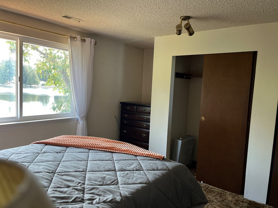Main home, Upstairs Bedroom #1 Queen bed, 2 dressers and sliding door closet