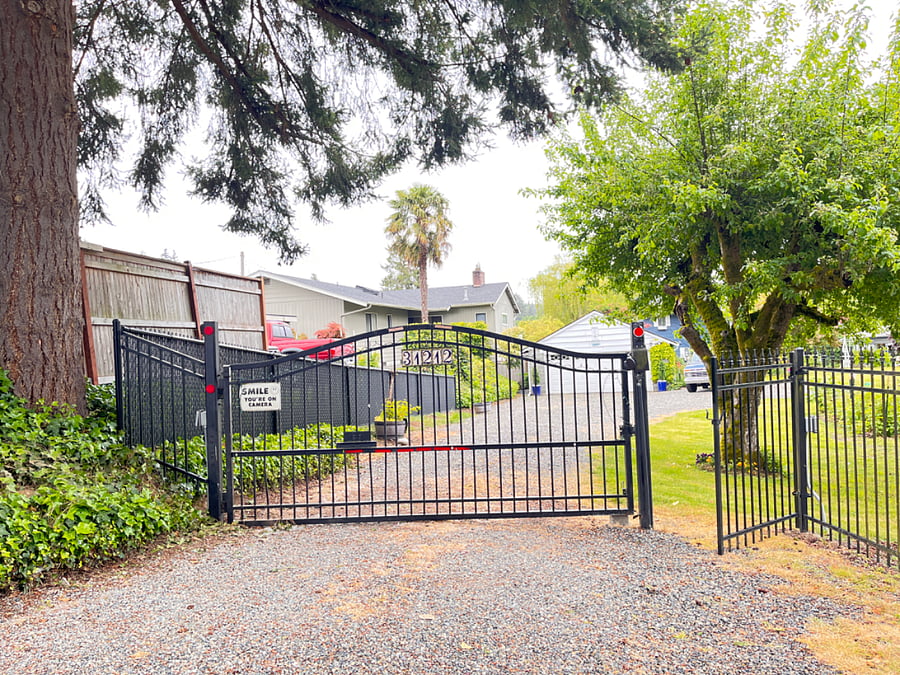 Entry to Main home and Studio Apartment with Automated Gate and Pedestrian gate, fully fence property and gate is lit at night.