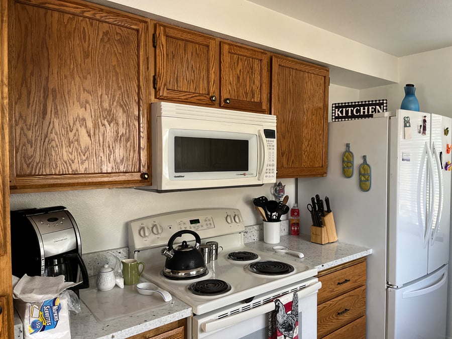 Main home, ground level full kitchen with electric range and oven, microwave, blender, toaster, all utensils, knives, side by side refrigerator with freezer drawer/ice maker