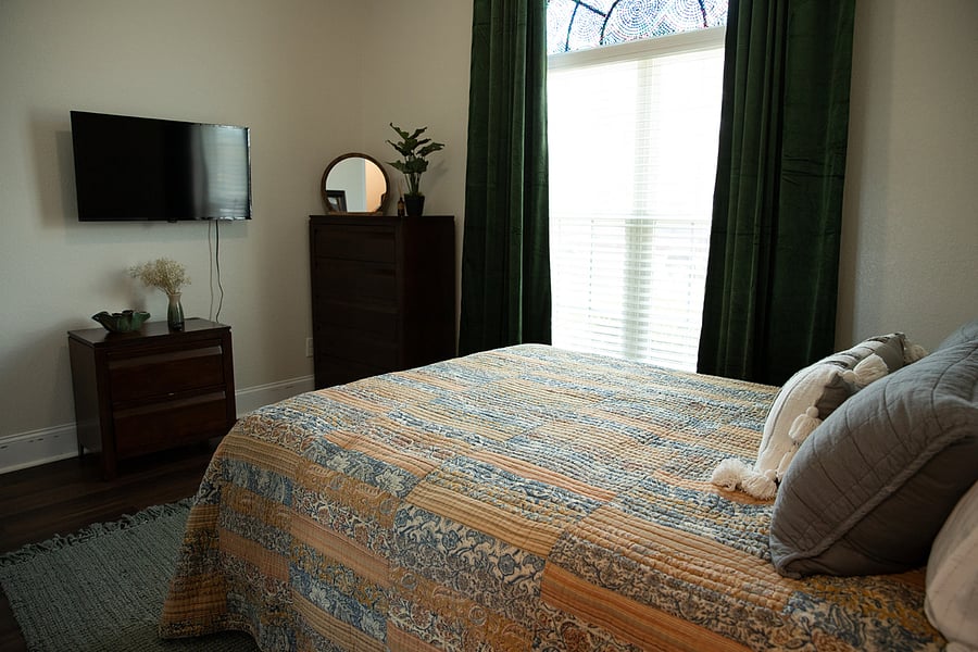Front Bedroom - Luxury Queen Bed, Velvet full Blackout Curtains, mounted Smart TV + Chest of Drawers