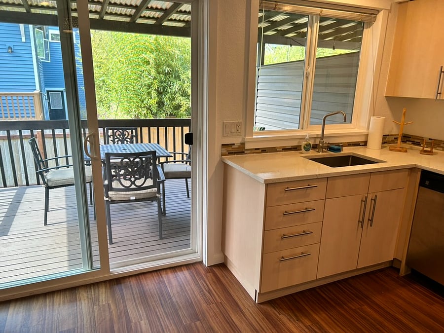 Kitchen and sliding door that leads to patio.