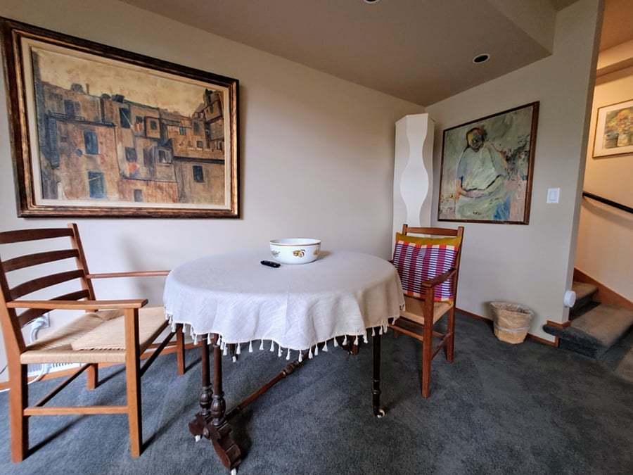 dining table, lots of original art throughout the whole apartment