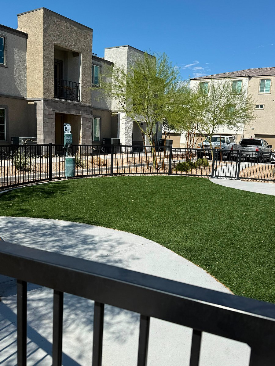 Small gated dog patch, turf, at the front of the community