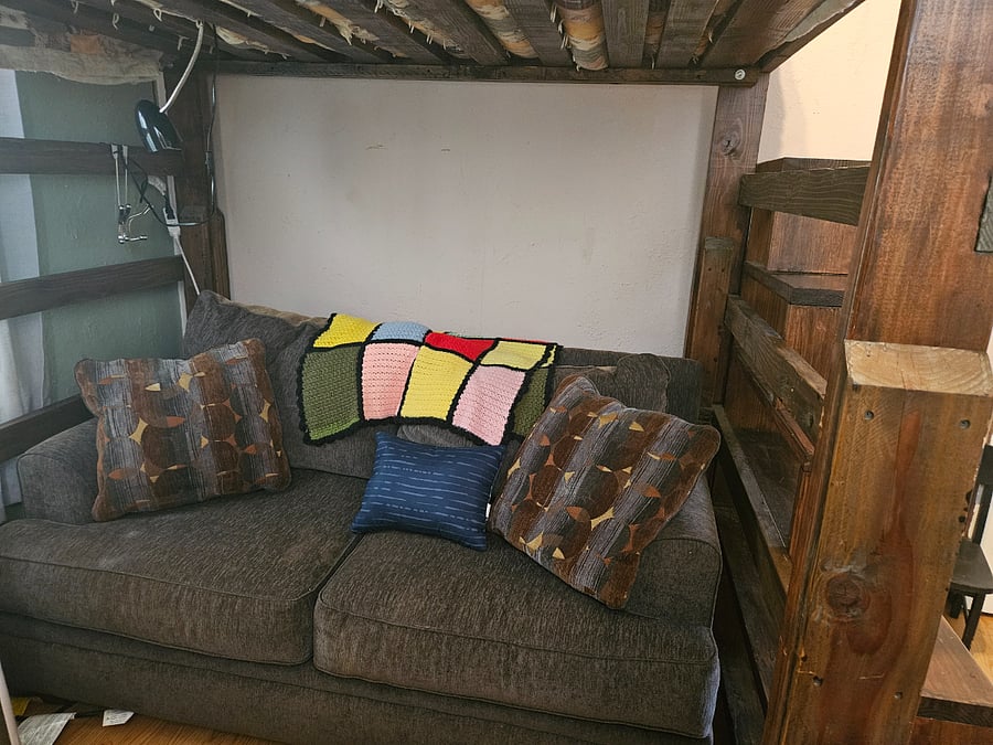 Loveseat-size couch under loft bed