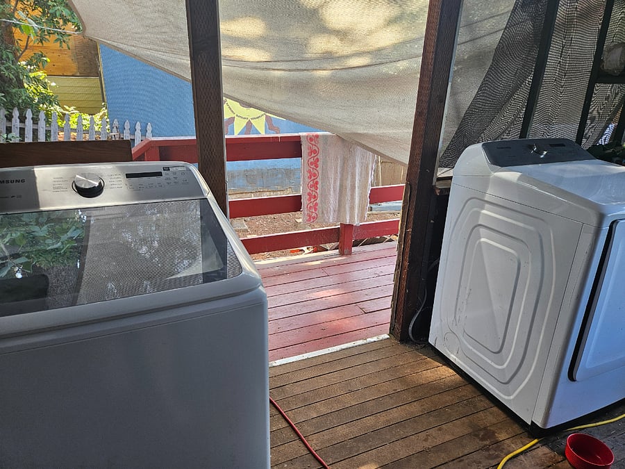 Washer and dryer on back porch