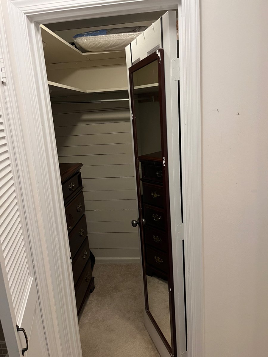 Walk-in closet off of bedroom one. 