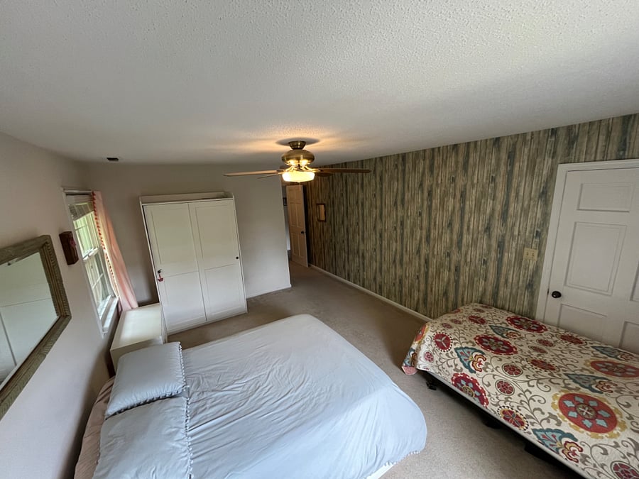 Bedroom one with full bed, twin bed, walk-in closet and full bathroom. 