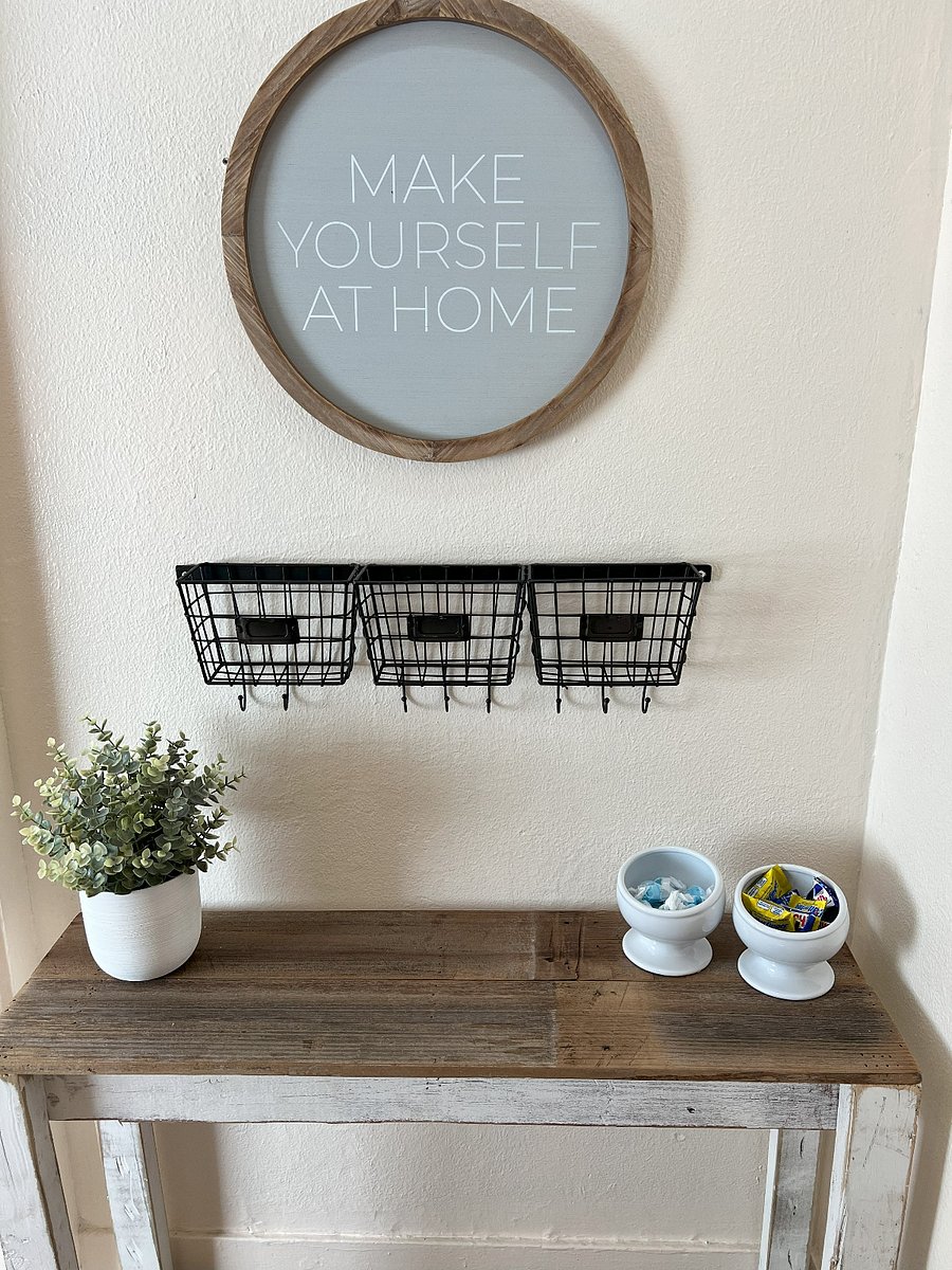 Entry way inside front door. Coat hooks to the right of the door.