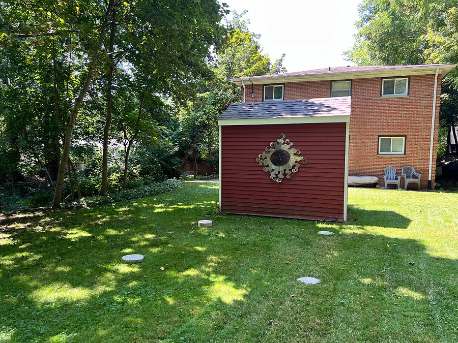 Large back yard with lots of shade.