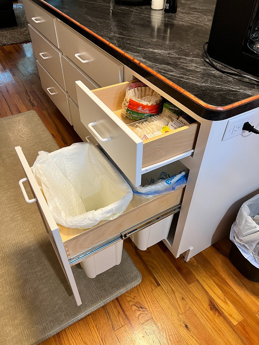 Pull out trash & recycle bins located within the island.