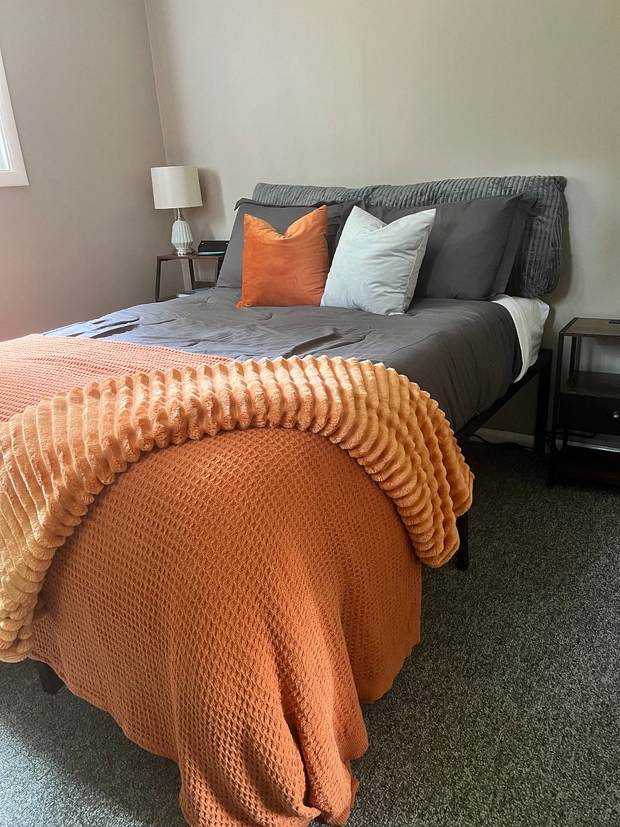 Full size memory foam mattress also has storage under the bed for suitcases.