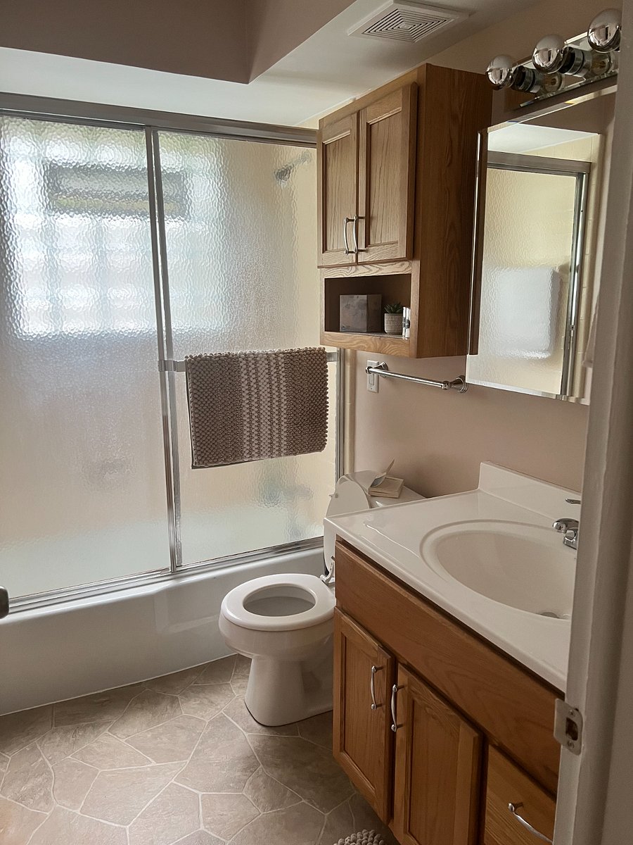 Bathroom boasts lots of natural light.
