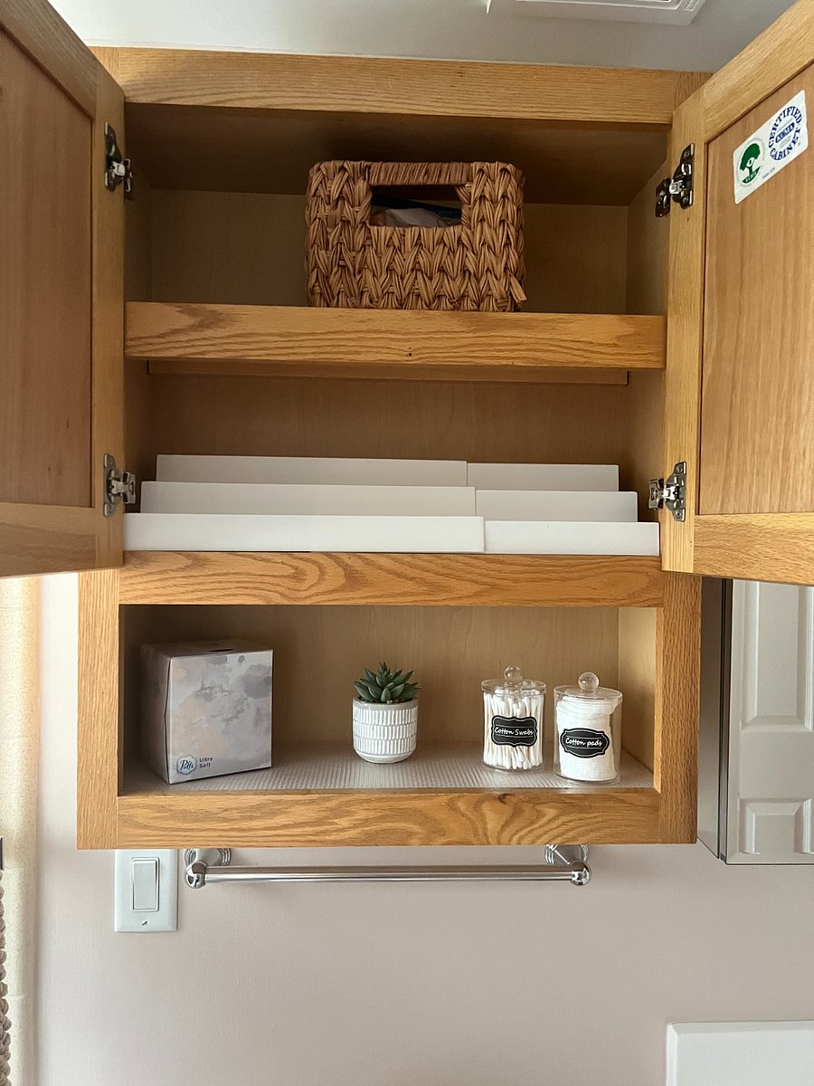 More personal item storage in the over the toilet cabinet. The shelf stackers are removable if needed.