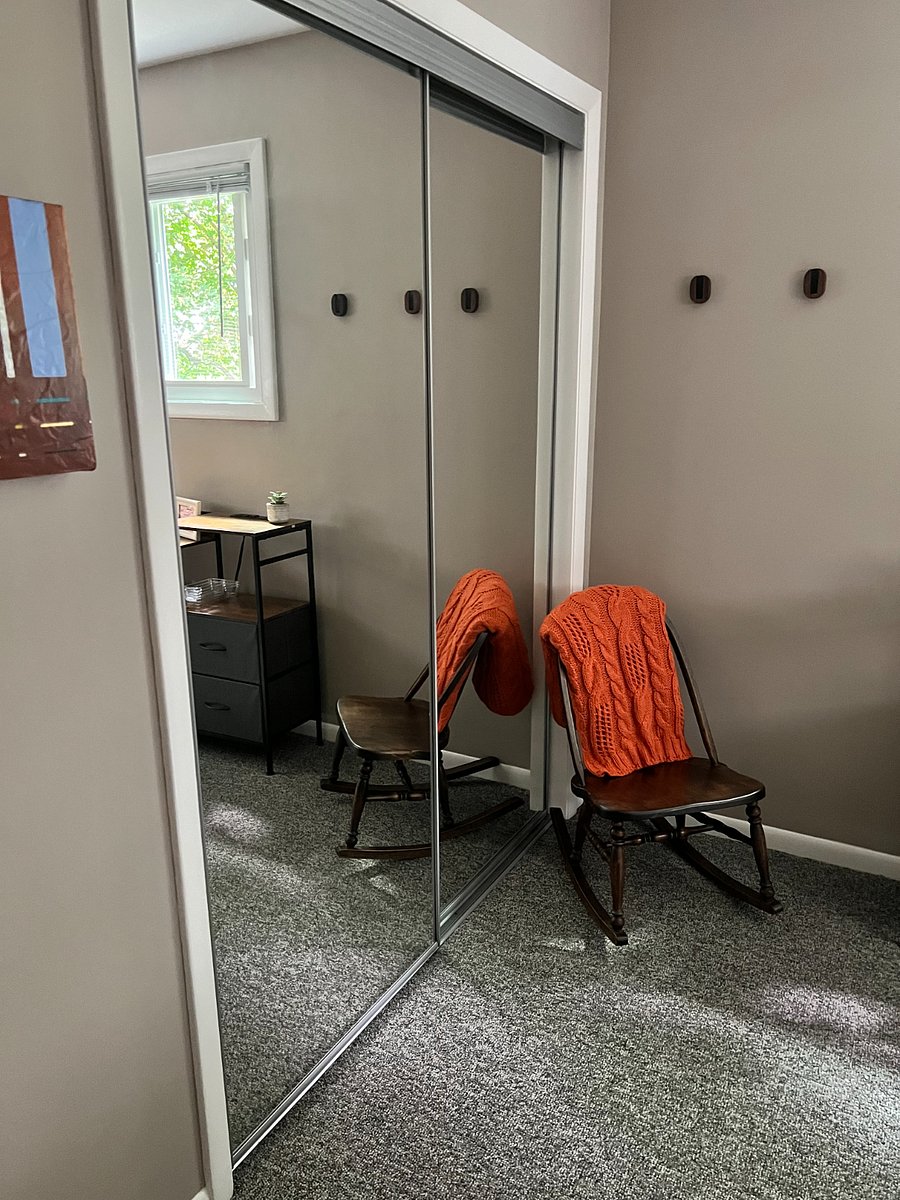 Each bedroom features mirrored sliding closet doors.