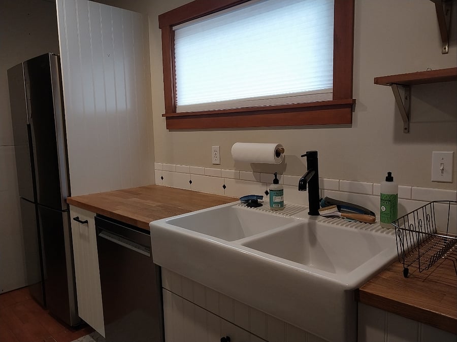 Kitchen with farmhouse sink and french door refrigerator