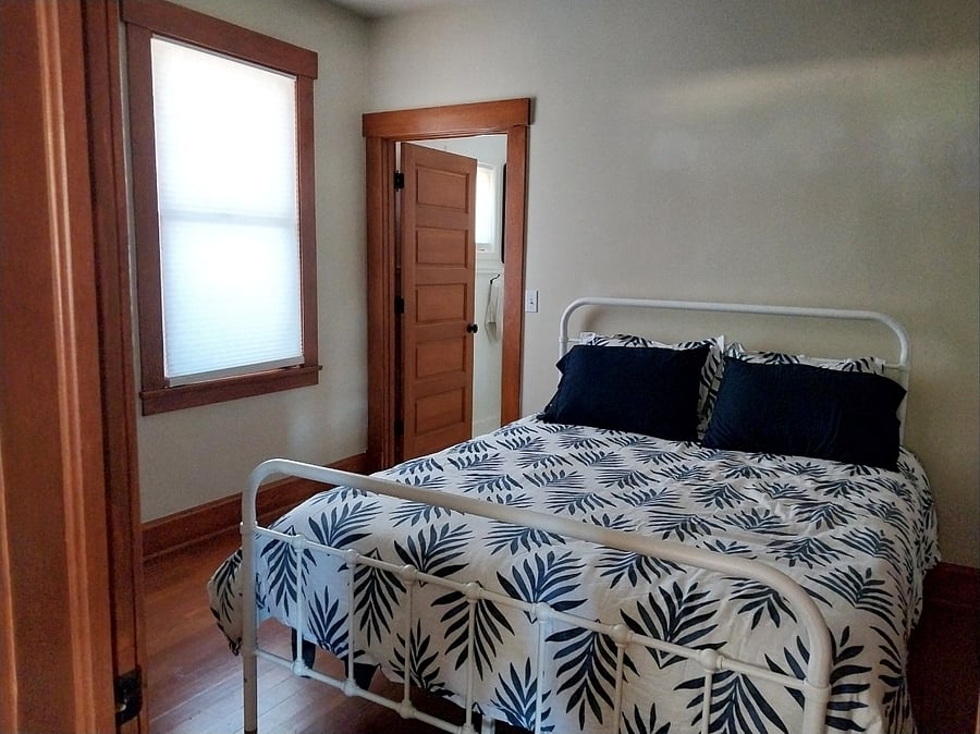 Bedroom with brand new queen mattress