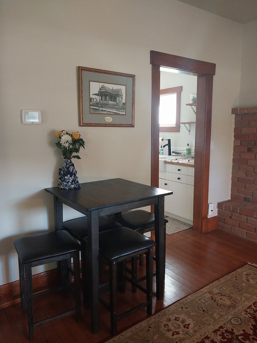Dining table next to kitchen
