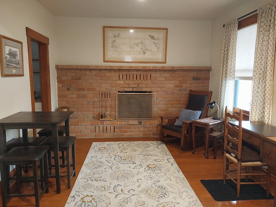 Living/dining area with large fireplace