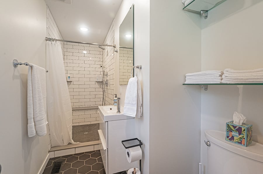 Main level bathroom has a huge tiled shower