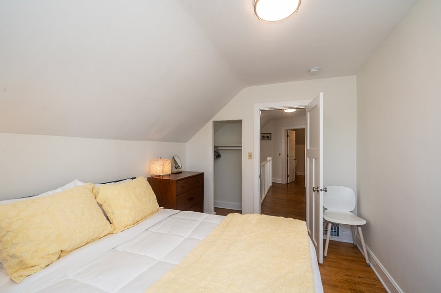 New furniture and linens in this cozy bedroom