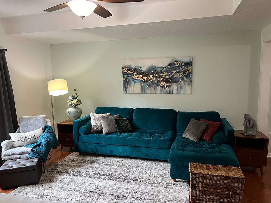 Comfy, teal, mid-century modern couch with chaise lounge and sleeper sofa.