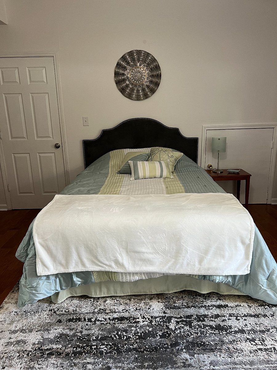 NEW queen sized-bed and extra sets of linens.